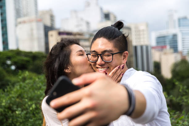 istock Asian Couple Taking a Selfie 915669314