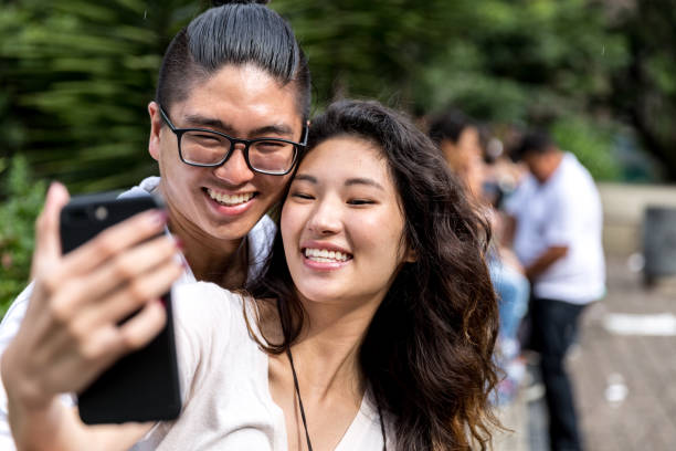 istock Asian Couple Taking a Selfie 915669332