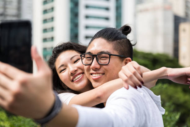 istock Asian Couple Taking a Selfie 915669384