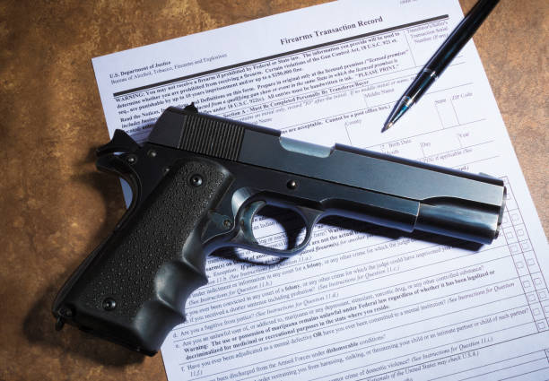 istock Handgun and firearm transfer form 915669888