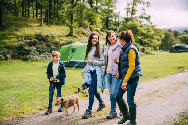 Family Hiking with the Dog Family are leaving the campsite they are staying in to go for a hike with the dog. keswick photos stock pictures, royalty-free photos & images