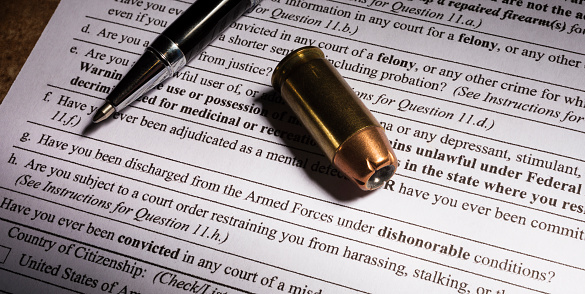 Cartridge and pen with dishonorable discharge question on FBI background check