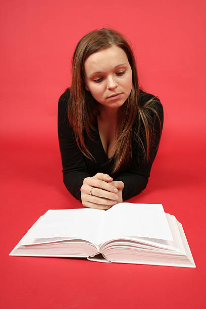 istock Schoolgirl with book 91567134