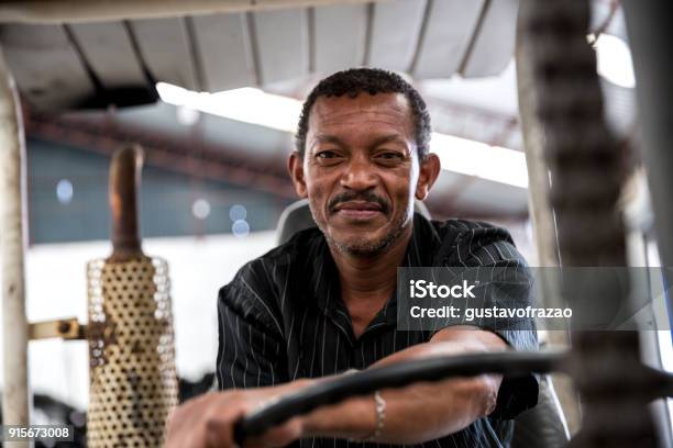 Worker On Forklift Looking At Camera Stock Photo - Download Image Now - Occupation, Brazil, Men