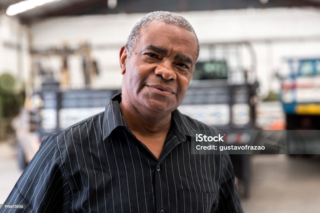 Portrait of Worker on Factory on background Men Stock Photo