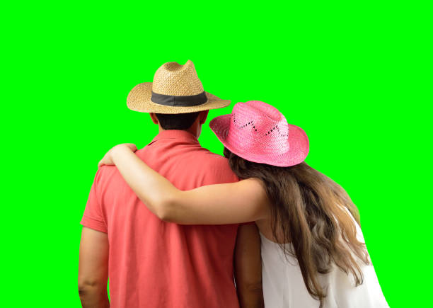 Couple silhouette cuddling and watching forward , isolated cutout on green background with chroma key