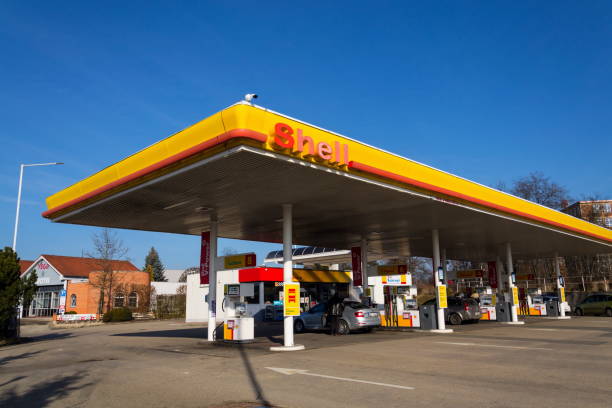 Royal Dutch Shell international oil and gas company logo on fuel station stock photo