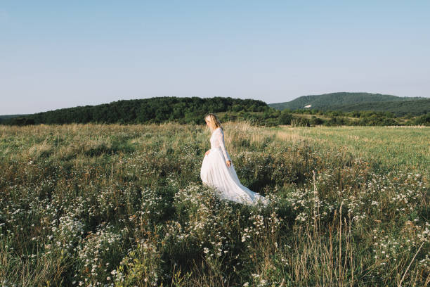 istock Beautiful bride walking outdoor 915687934