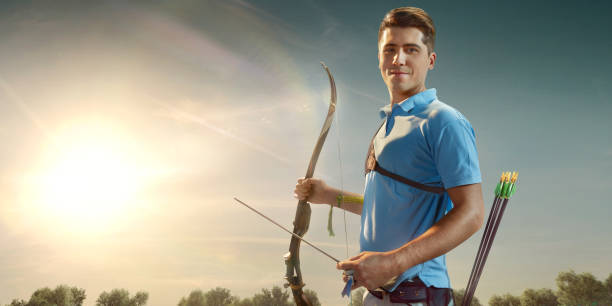 istock Male archer shooting with the longbow at sunset 915688172