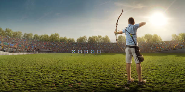 A man is shooting with a recurve bow during un open archery competition. Hands and bow only