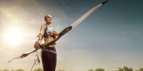istock Female archer shooting with the longbow at sunset 915688214