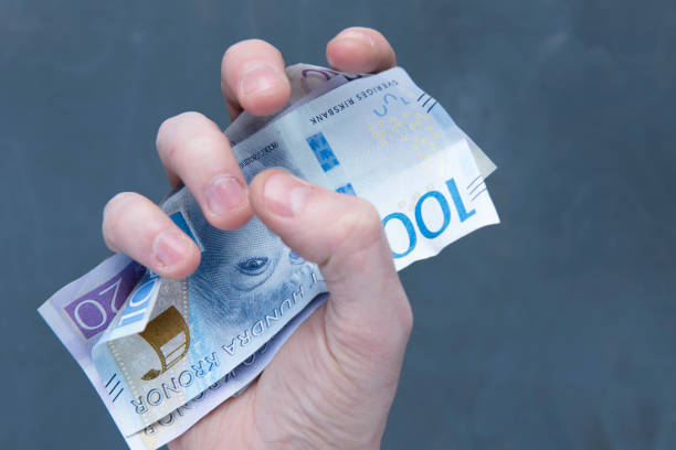 istock hand with money 915688260