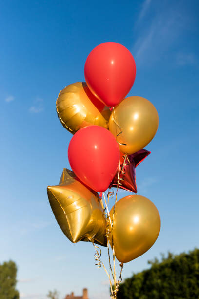 istock Red and Yellow Balloons 915689582