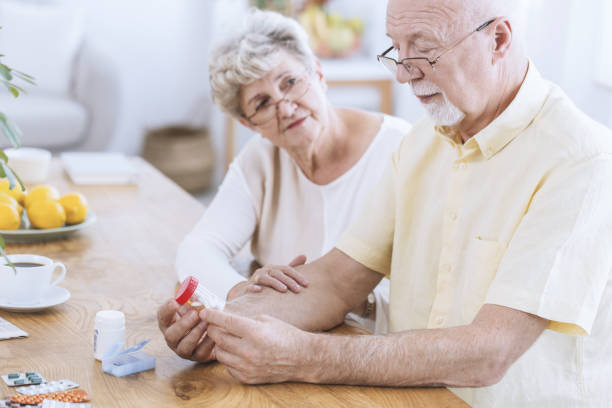 istock Worried wife supporting sick husband 915695498