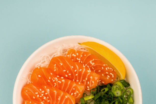 Healthy Hawaiian Smoked Salmon Sashimi Bowl With Rice Noodles and Chopped Spring Onions
