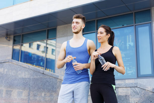 istock Woman and man is having break, drinking water 915697706