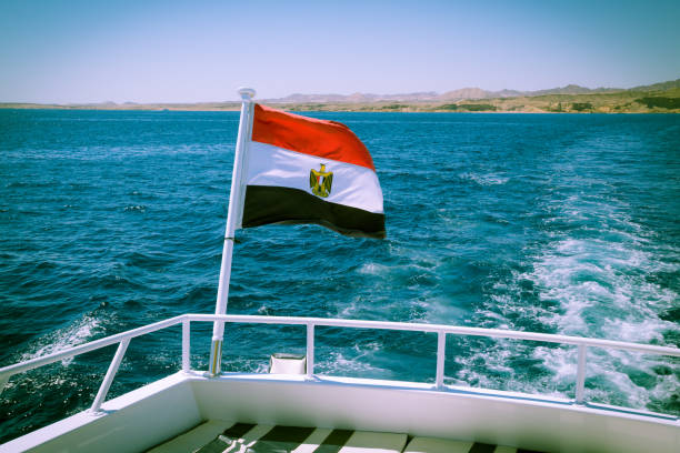 egyptian flag on the white yacht deck sway on the wind, red sea resort concept