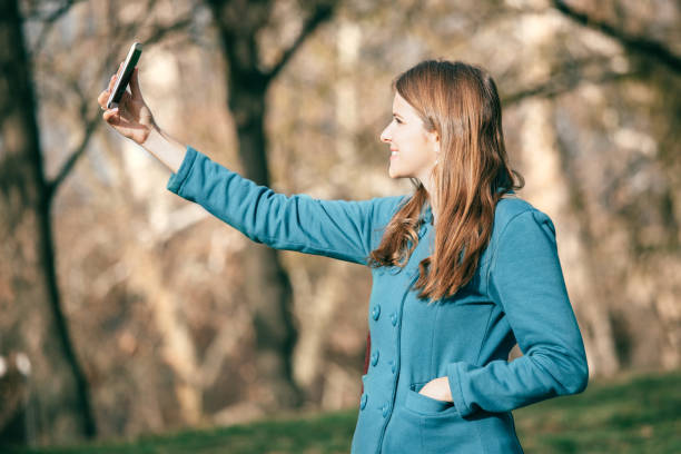 istock Beautiful woman taking a selfie 915708166