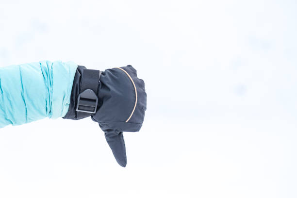 istock Hand in winter glove gesture dislike or thumb down 915708364