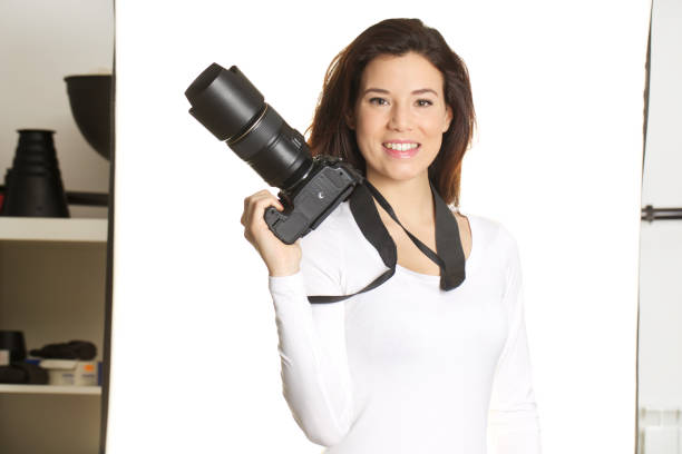 young female photographer work in her studio