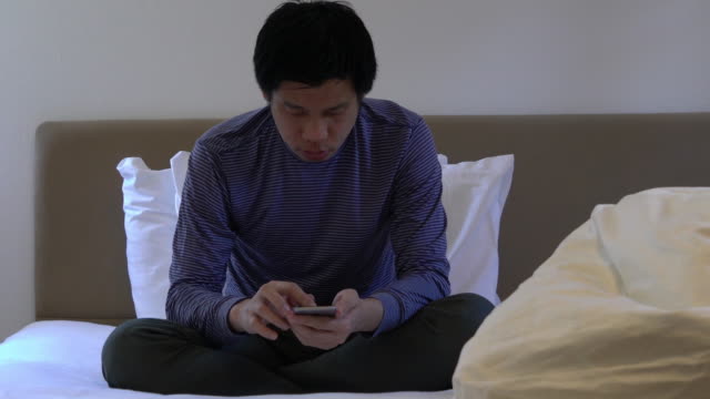 Business man working with mobile device in the hotel