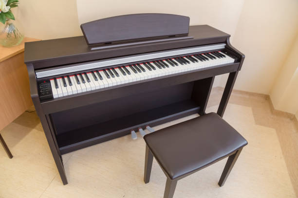 istock modern wooden black piano in music classrom isolated 915736154