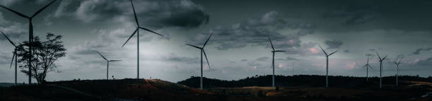 istock energy saving concept with panorama view from wind turbine construction in field and meadow on mountain with beauty blue sky and cloudy background 915740154