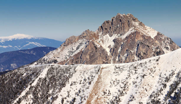 istock Snowy landscape view of hills. 915740244