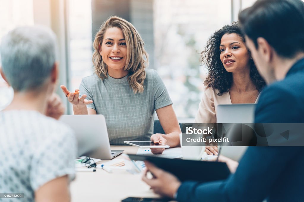Female manager discussing business Group of people on a business meeting Business Stock Photo
