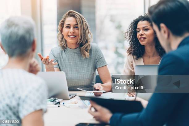 Female Manager Discussing Business Stock Photo - Download Image Now - Business, Teamwork, Leadership
