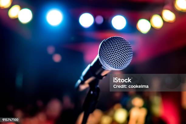 Microphone On Stage Against A Background Of Auditorium Stock Photo - Download Image Now
