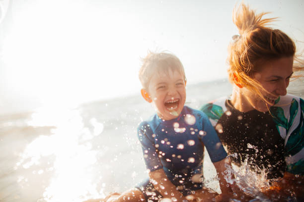 Mother and son enjoy sea water
