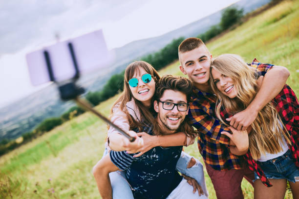 istock Group of friends taking a selfie. 915753662