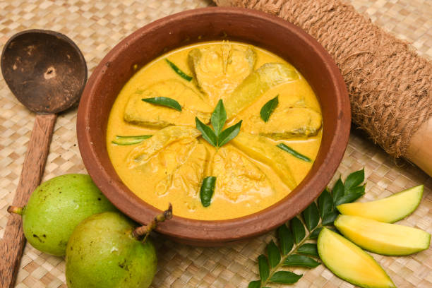 istock Chinese Salmon or Barracuda fish curry yellow colour with thick coconut milk. Indian fish molee or Moli masala curry 915759516