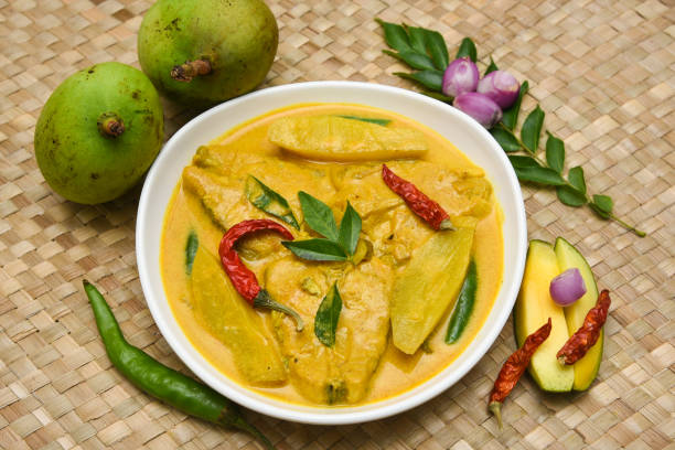 istock Chinese Salmon or Barracuda fish mango curry yellow colour with thick coconut milk. Indian fish molee or Moli masala curry 915759868