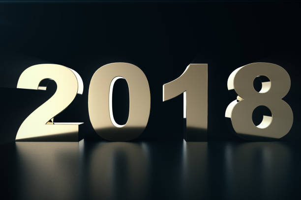istock 3d illustration of a golden text on a black background with reflection on the floor. 3d text 2018 happy new year. Gold text 915764114