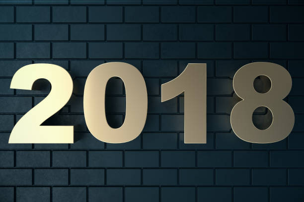 istock 3d illustration of a golden text on a black background with reflection on the floor. 3d text 2018 happy new year. Gold text 915764134