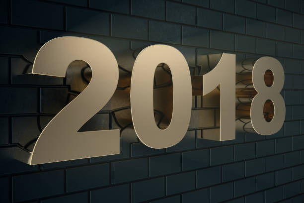 istock 3d illustration of a golden text on a black background with reflection on the floor. 3d text 2018 happy new year. Gold text 915764156