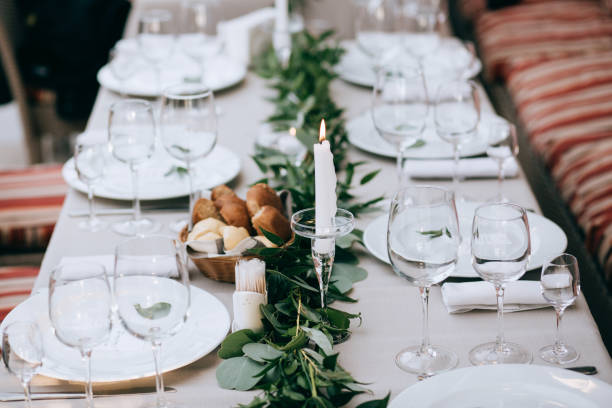 istock Wedding table setting decoration flowers and green leaves 915768092
