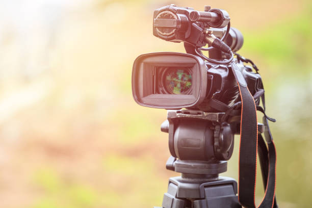 istock Professional digital video camera. Outdoor setup and working 915775594