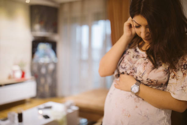 istock Young pregnant woman at home 915780302