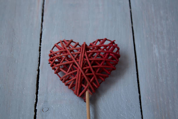 istock red heart on a grey wooden bacground 915780572