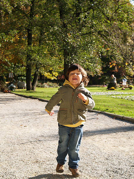 istock Boy running in the park 91578217