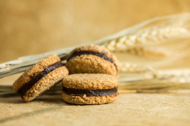 Integral Vanilla Cookies Fresh and healthy integral vanilla cookies decorated with simple bouquet of wheat plant old candy store stock pictures, royalty-free photos & images