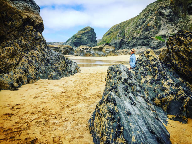 istock Woman looking back to camera on Beach 915786572