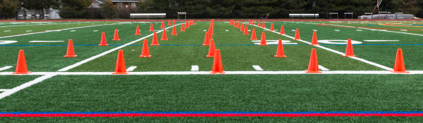 Turf field with orange cones set up for speed training