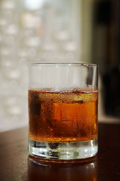 istock glass of whisky with an ice 91579082