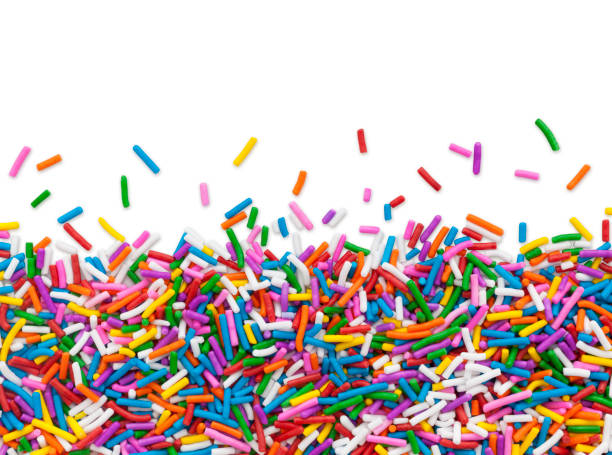 Cake Sprinkles Border Multi colored cake sprinkles bottom border isolated on white (excluding the shadow) for the top white part sugar food stock pictures, royalty-free photos & images