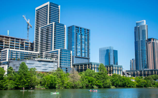 istock Buildings with cranes on summer day 915792358