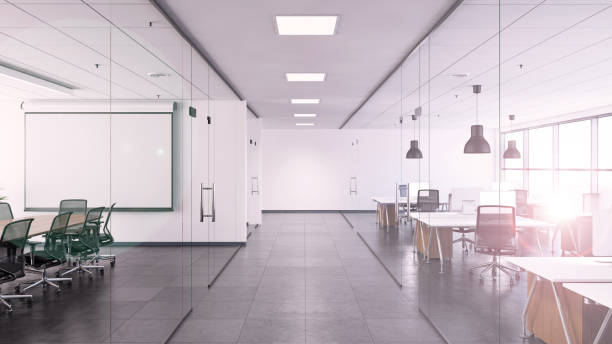 Office interior with large desk and blank writing board